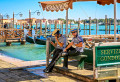 Gondoliers on the Pier in Venice