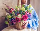 Young Woman with a Basket of Flowers