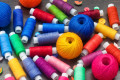 Threads and Buttons on a Wooden Table