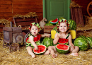 Kids Eating Watermelons in the Barn