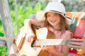 Cute Little Girl Playing Guitar