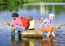 Three Men Fishing on a River in Summer