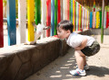 Child Feeds a Goat at the Zoo