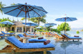 Beach Chairs and Umbrellas on the Pool