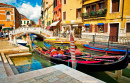 Narrow Canal with a Boat in Venice, Italy