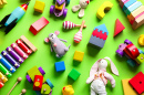 Children's Toys on a Green Background