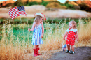 Two Little Girls Waving American Flag