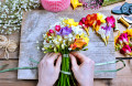 Florist Making a Bouquet of Freesia Flowers