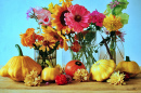 Autumn Flowers and Pumpkins on a Wooden Table