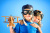 Happy Children Playing with a Wooden Airplane