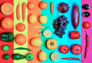 Vegetables and Fruits on a Rainbow Background