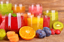 Fresh Fruit Juices on a Wooden Table