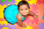 Happy Baby Girl on Colorful Play Mats