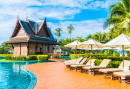 Umbrellas and Sun Loungers around an Outdoor Pool