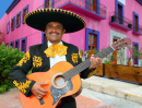 A Mariachi Singer Playing Guitar in Mexico